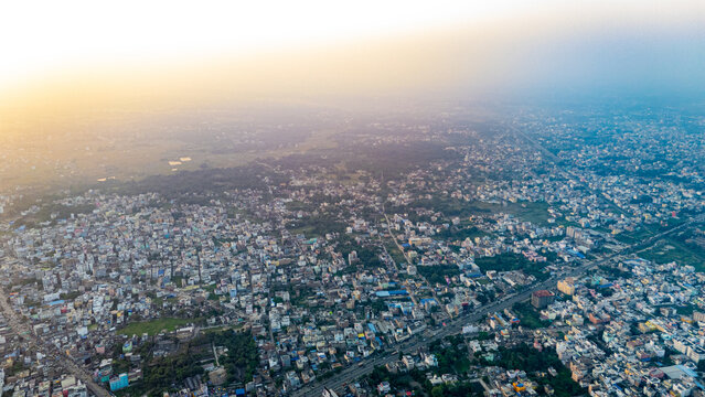 Top down Buildings and Apartment with Multiple Building aerial. Urban Buildings and Apartment at bridge road at Delhi. Cinematic cityscape drone shot. Noida Buildings.