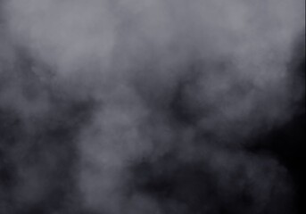 Thick Gray Smoke or Abstract Fog Moving on Dark Background, Ominous and Mysterious Texture for Special Effects, Industrial Vapors, or Ethereal Atmosphere