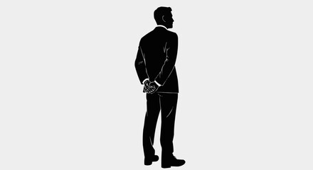 Silhouette of a businessman standing with hands clasped behind his back.