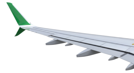 Modern commercial airplane wing and green winglet isolated on white background for travel design