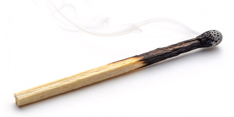 Evocative burnt matchstick with delicate smoke trails against a clean backdrop perfect for fire safety campaigns or symbolic imagery