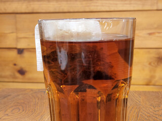 Tea. Black tea brewed in a glass. Hot brewed tea