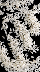 Obraz premium white rice on a black isolated background