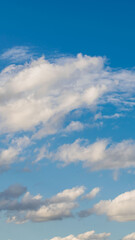 white nice clouds on a background of blue sky