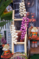 Autumn harvest garlic and onions with fox dolls decor