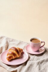 Breakfast Composition With Croissant And Coffee On Pink Plate And Cup With Beige Background