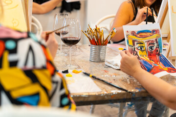 People enjoying creative sip and paint workshop