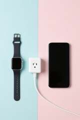 Modern Arrangement Of Smartphone Smartwatch And Charger On Dual Colored Background
