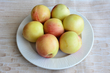 Fresh Nectarines on a White Plate cut out