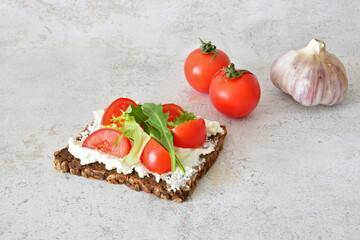an Open-Faced Sandwich with Tomatoes, Cream Cheese and Garlic