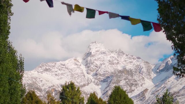 Landscape shot of clouds above the snowy Himalayan mountain peaks during the winter season as seen from Keylong in Lahaul and Spiti district, Himachal Pradesh, India. Scenic view of Himalayas.