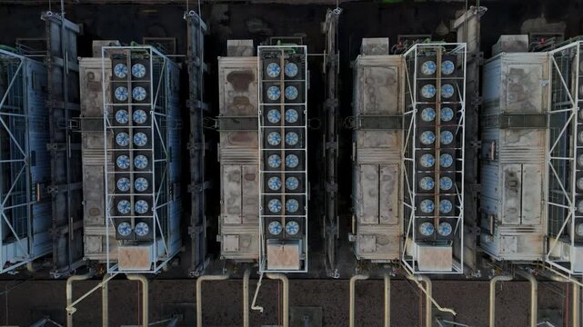 Aerial view of large-scale industrial machinery with multiple fans shows a pattern of mechanical intensity and uniformity, Newark, England, United Kingdom.