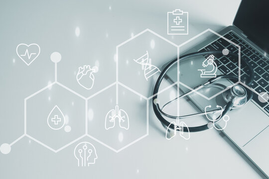 Stethoscope on laptop with medical icons. Healthcare technology, digital health, and electronic patient record (EHR) data on a virtual interface concept.