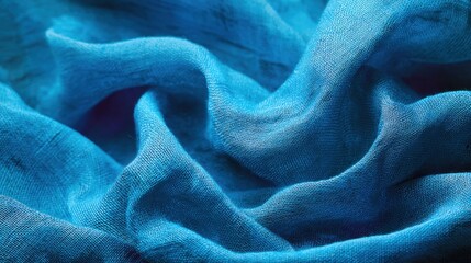 Abstract blue fabric texture with soft folds