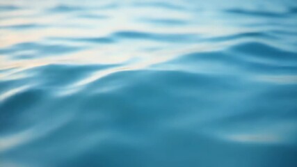 Gentle ocean waves creating a soft rhythmic surface in natural daylight with reflections of sky and sunlight on calm water concept of marine conservation travel tourism wellness, relaxation industry