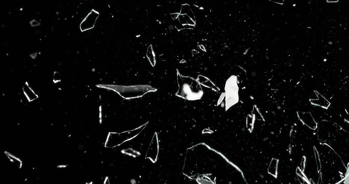 This engaging video showcases the spontaneous phenomenon of glass breakage against a dark background, ideal for enhancing motion graphics and creating stunning visual effects for your projects