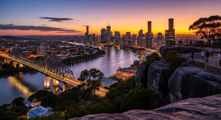 Fototapeta premium Brisbane Cityscape at Sunset with Story Bridge and River.