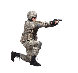 Fototapeta premium A man in an American soldier's uniform kneels down, holding a pistol
