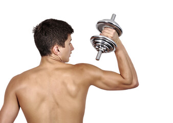 A young man stands with his back to the ground with a bare torso and holds a dumbbell in his hands.