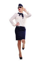 A young female flight attendant stands full-length in her uniform