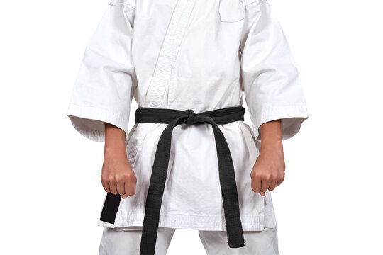 A karate guy in a white kimono and a black belt got ready to do Kata. Strength, endurance, and martial arts concept