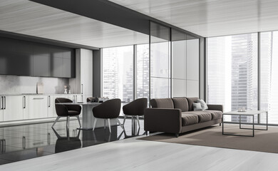 Corner of grey panoramic kitchen with brown sofa