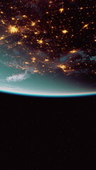 A breathtaking scene showcases Earth from space, revealing twinkling city lights against a dark background.
