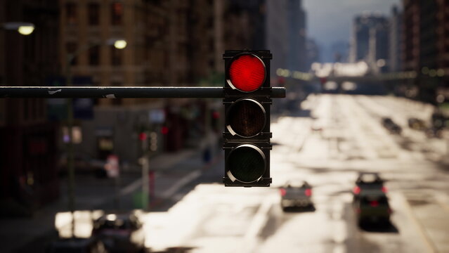 A vibrant city intersection shows a bright red traffic light as vehicles navigate the road. The scene captures the rush of urban life and the importance of traffic signals.