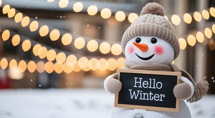 Cute snowman wearing a hat and scarf holding a hello winter sign