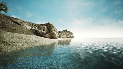 Fototapeta premium Gentle waves lap against a sandy beach as sunlight dances on the waters surface. A rocky cliff rises on one side, with trees dotting the landscape, creating a serene coastal view.