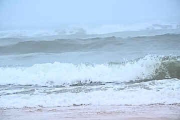 Foggy beach along the Atlantic ocean on a summer morning in Over, Portugal
