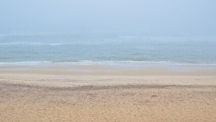 Foggy beach along the Atlantic ocean on a summer morning in Over, Portugal 
