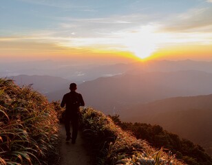 Obraz premium Lone Backpacker Walking on Mountain Trail at Sunrise — Peaceful Scenic Nature Landscape
