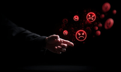 A pointing finger emanating angry emoji on a dark background, concept of anger.