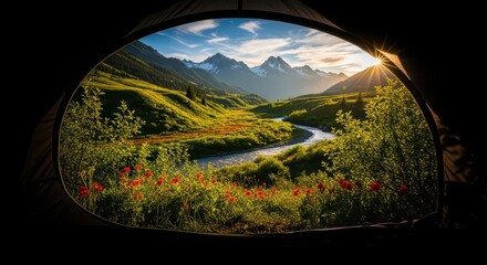 Scenic mountain view from tent with river and wildflowers at sunset