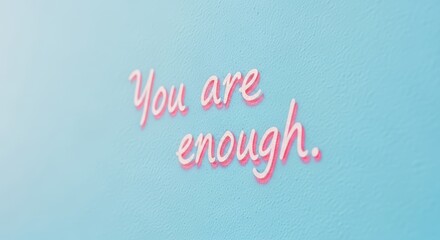 Inspirational pink message on light blue background: you are enough