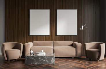 Obraz premium Contemporary interior with beige armchairs, sofa, marble table, and two empty posters on dark wooden wall background. Concept of design and layout. 3D Rendering