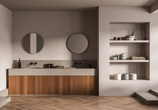 Modern minimalist bathroom interior with twin round mirrors, wooden cabinetry, and built-in shelf decor on neutral wall background. 3D Rendering