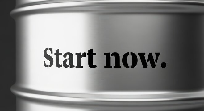 Motivational message on metallic surface: start now