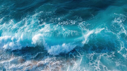 Fototapeta premium Aerial view of crashing ocean waves in deep blue