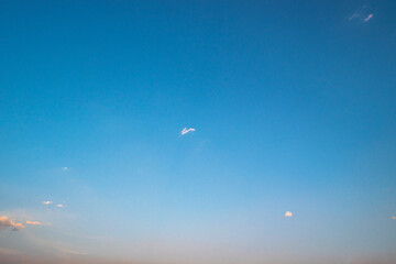 golden light before sundown. copy space.Blue sky with soft cloud on sunrise or sunset time. Nature background