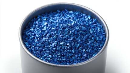 Bright blue glittery particles in metallic container