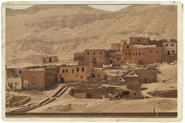 Abandoned tomb robbers' village in Luxor. village ​​of craftsmen in Upper Egypt, Luxor, City of the Dead. Toned Image in a old paper frame 