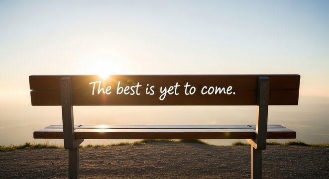 Inspirational sunrise quote on park bench with scenic view