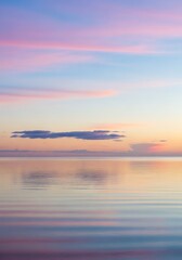 Fototapeta premium Tranquil seascape featuring pastel sunset hues reflecting in calm water