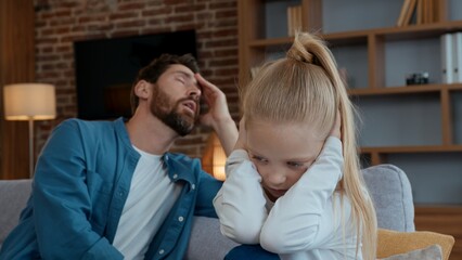 Caucasian family problem angry father yelling argument to sad daughter closing ears ignoring dad offended little child kid girl difficult parenting bad behavior negative daddy talking misunderstanding