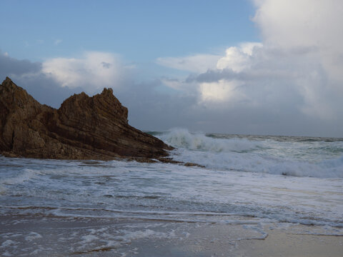 Ocean Waves Crashing Against Rugged Rocks on Murder Hole Beach in County Donegal Ireland