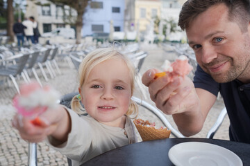 Girl Eating Ice Cream with Her Dad at a Cafe