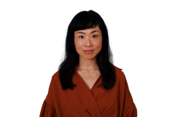 East asian woman maintaining eye contact, portraying seriousness and confidence. Png image with transparent background