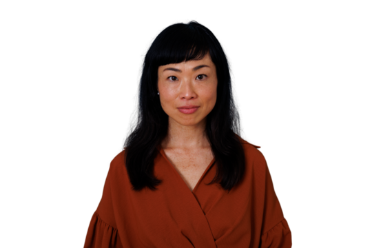 East asian woman maintaining eye contact, portraying seriousness and confidence. Png image with transparent background